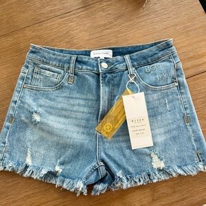 Risen Mid-Rise Distressed Jean Shorts in Medium Blue